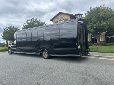 Black 26 passenger party Bus